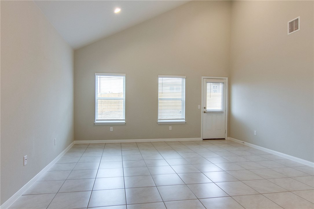 6916 Ranchito Drive Austin, TX 78744 - Photo 9 of 37 a view of an empty room with a window