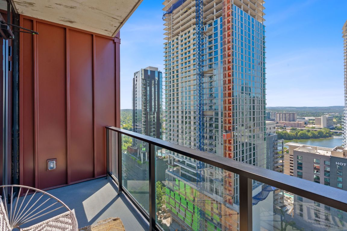 84 East Avenue, Unit 2410 Austin, TX 78701 - Photo 24 of 40 Representative of Property. Balcony with a view of city and a water view