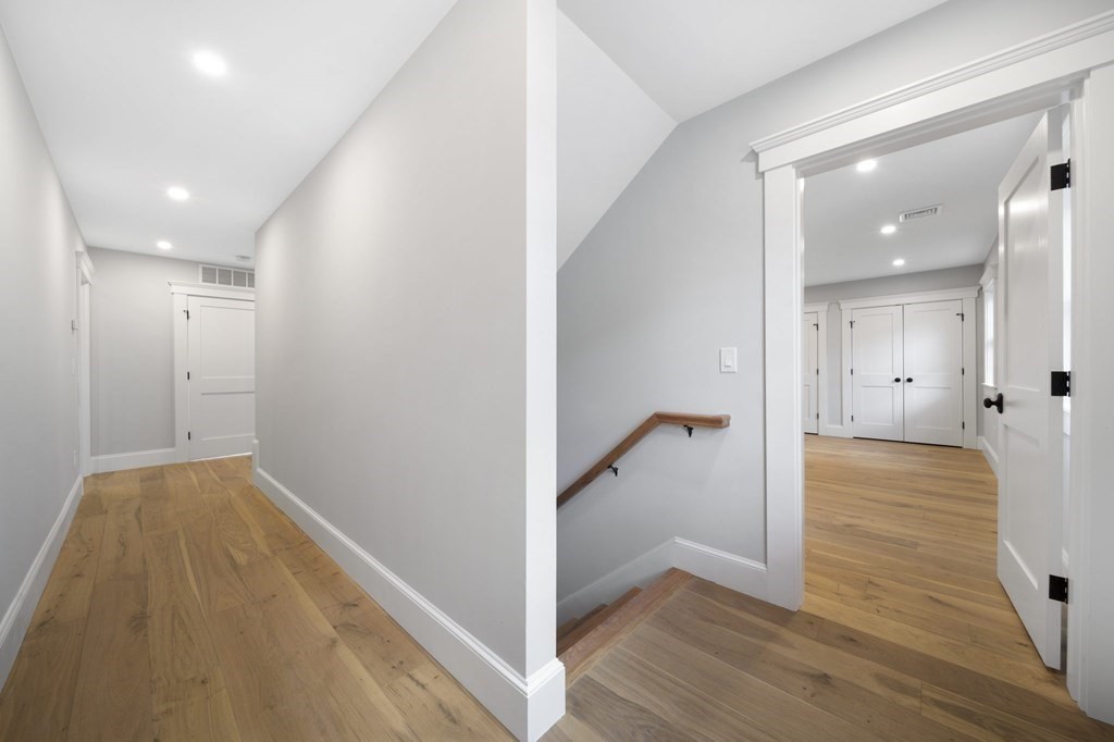 9 Whitford Street, Unit 9 Boston, MA 02131 - Photo 11 of 25 a view of a hallway with wooden floor and closet