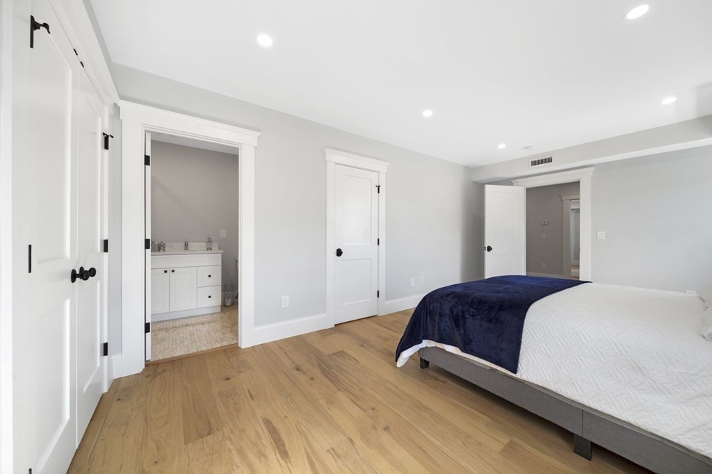 9 Whitford Street, Unit 9 Boston, MA 02131 - Photo 14 of 25 a bedroom with a bed and a closet