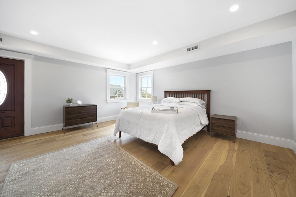 9 Whitford Street, Unit 9 Boston, MA 02131 - Photo 18 of 25 a bedroom with a bed and a tv