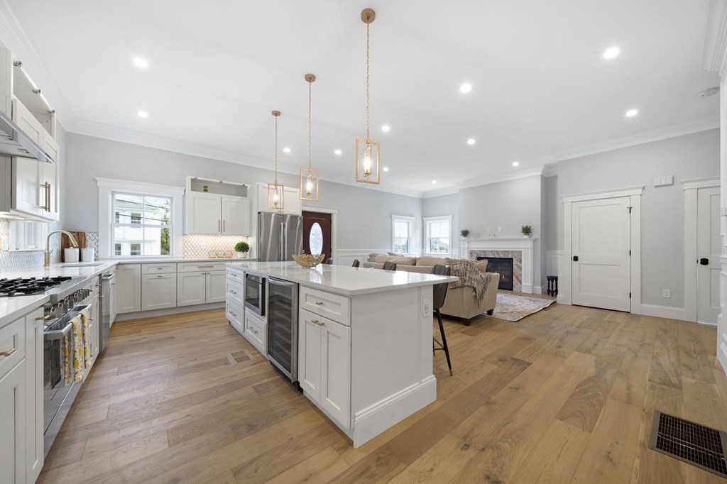 9 Whitford Street, Unit 9 Boston, MA 02131 - Photo 2 of 25 a large kitchen with stainless steel appliances lots of counter top space