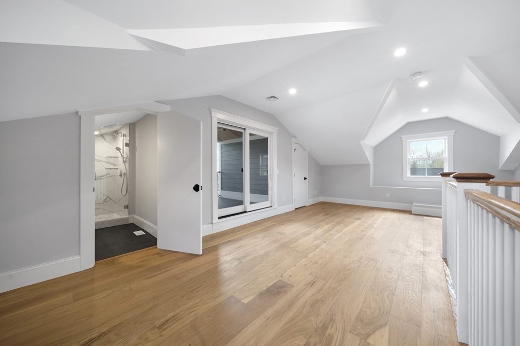 9 Whitford Street, Unit 9 Boston, MA 02131 - Photo 22 of 25 an empty room with wooden floor and windows