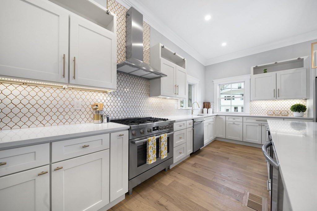 9 Whitford Street, Unit 9 Boston, MA 02131 - Photo 3 of 25 a kitchen with white cabinets and white appliances