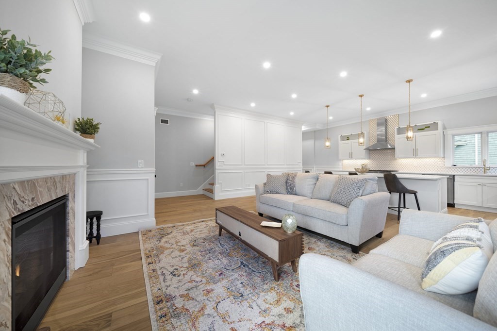 9 Whitford Street, Unit 9 Boston, MA 02131 - Photo 5 of 25 a living room with furniture and a fireplace
