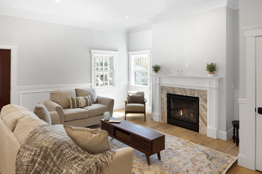 9 Whitford Street, Unit 9 Boston, MA 02131 - Photo 7 of 25 a living room with furniture and a fireplace