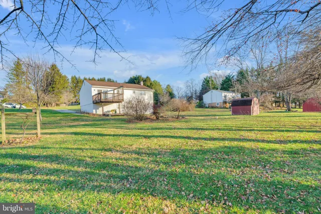 a house view with a big yard