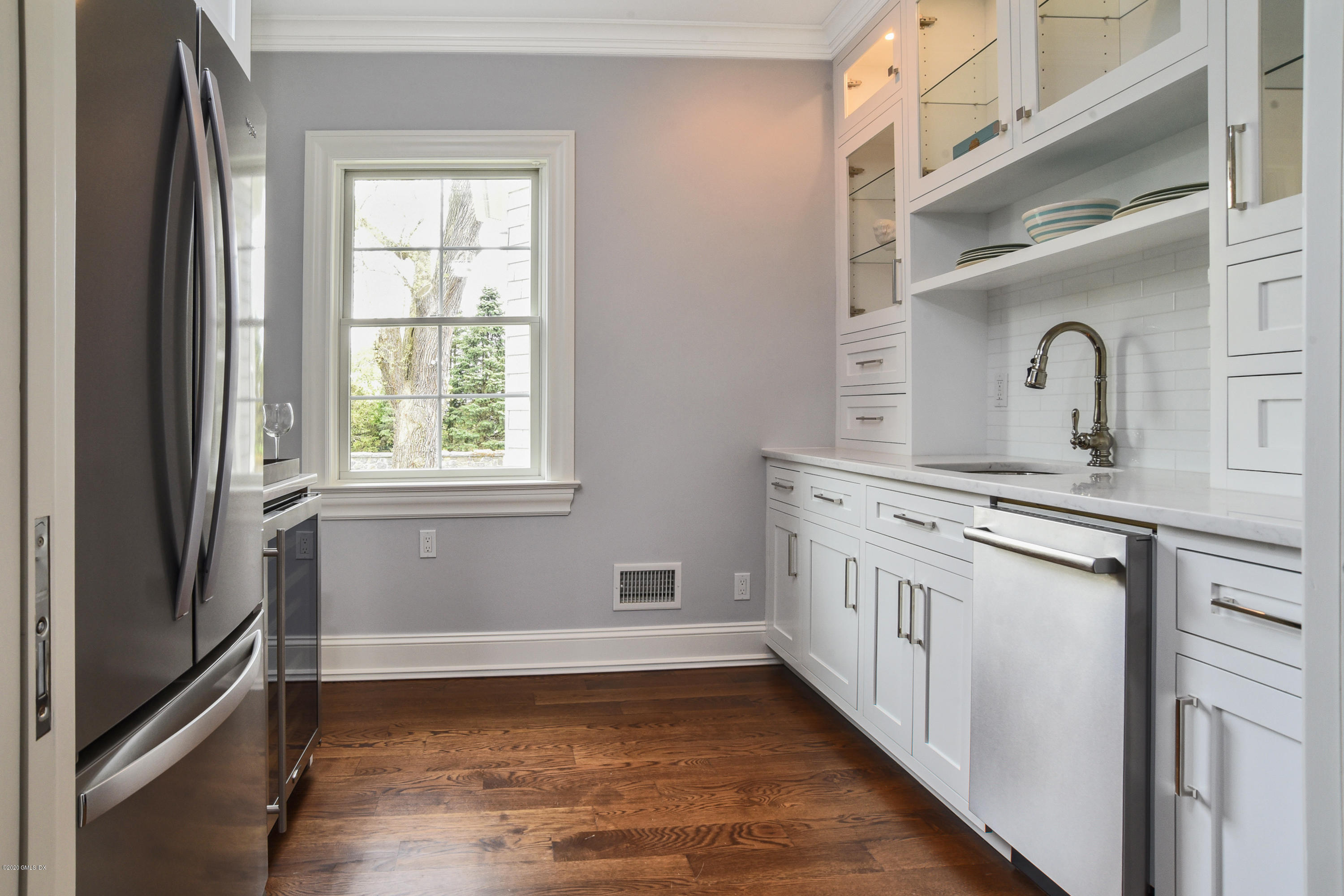 154 Byram Shore Road Greenwich, CT 06830 - Photo 12 of 37 a kitchen with stainless steel appliances a sink and a stove