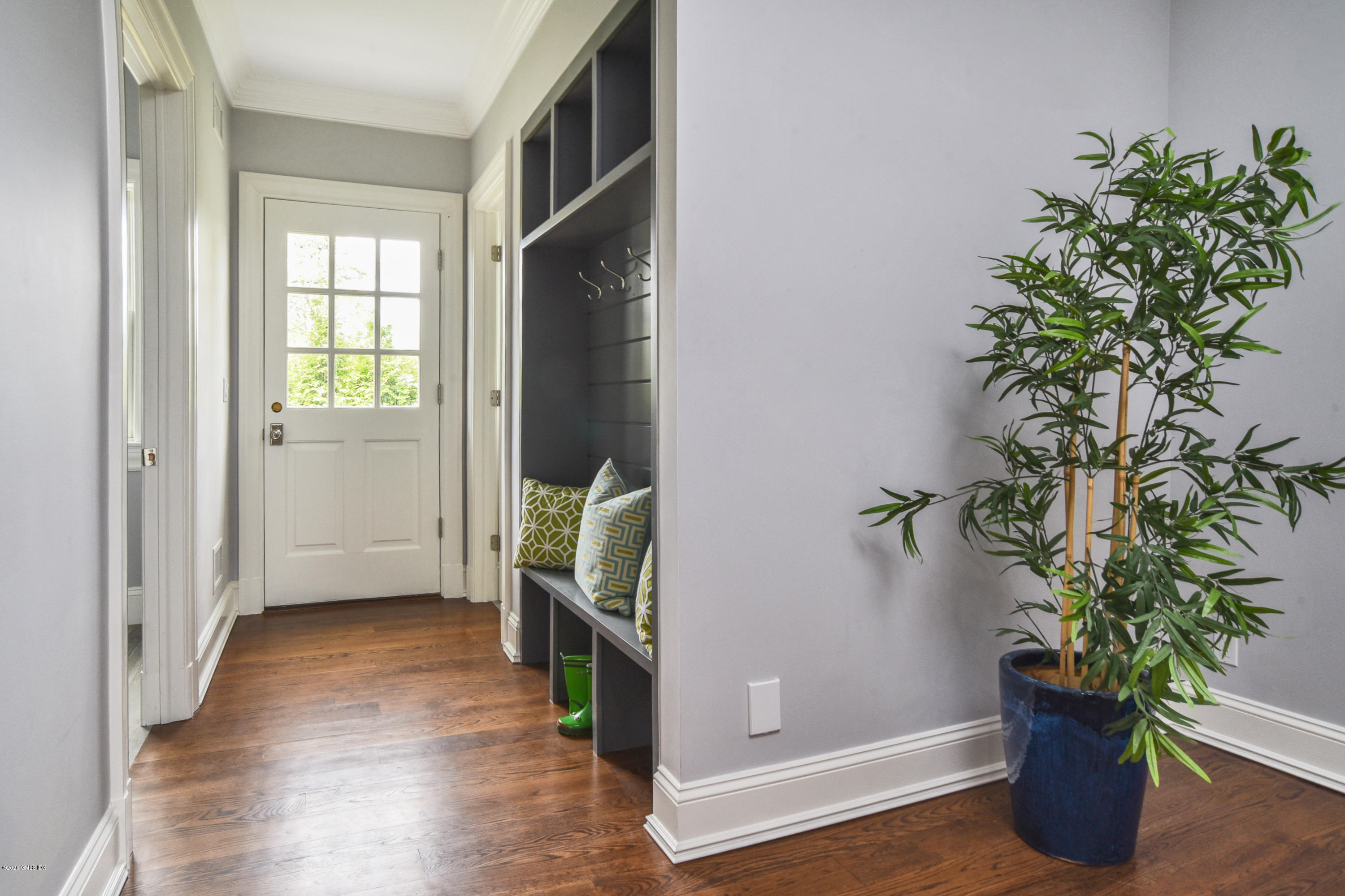 154 Byram Shore Road Greenwich, CT 06830 - Photo 19 of 37 an entryway with wooden floor and a potted plant