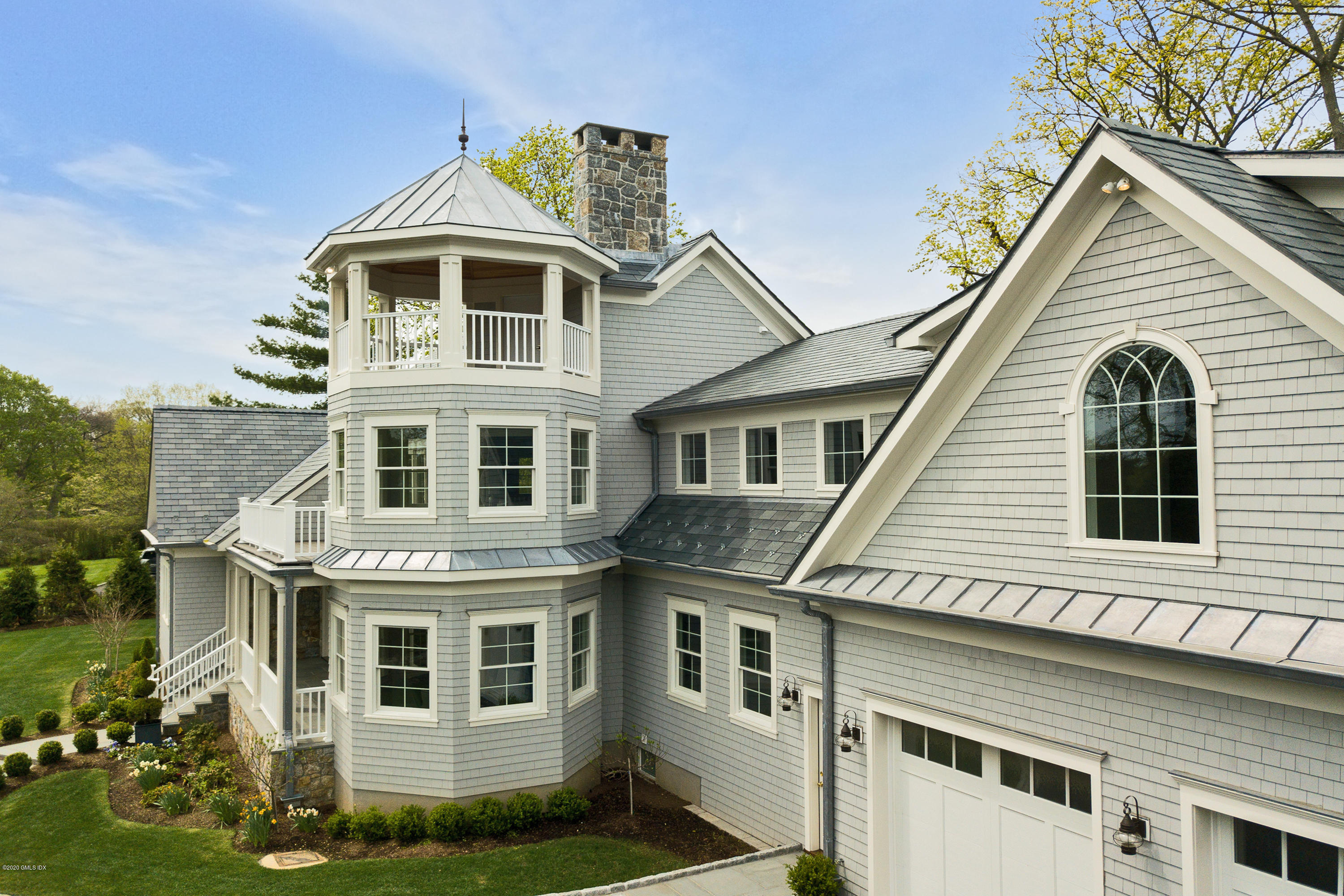 154 Byram Shore Road Greenwich, CT 06830 - Photo 29 of 37 a front view of a house with a yard