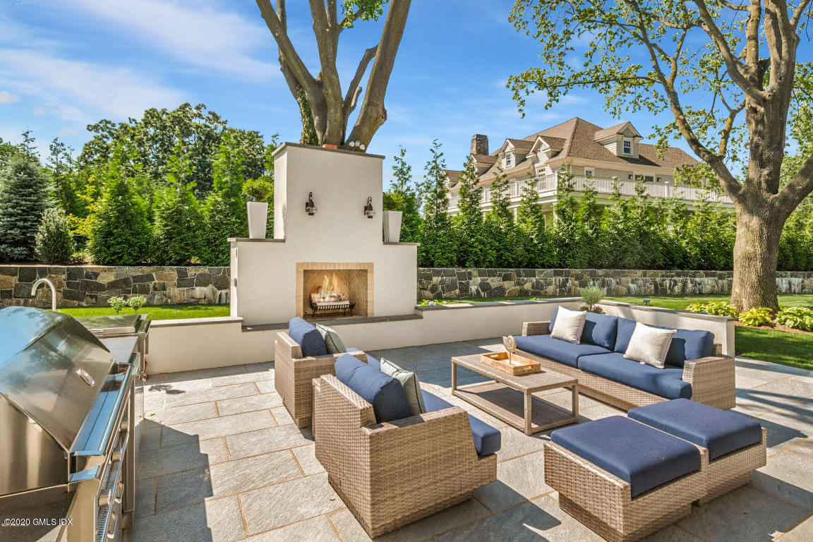 154 Byram Shore Road Greenwich, CT 06830 - Photo 30 of 37 a view of a patio with couches and a fire pit