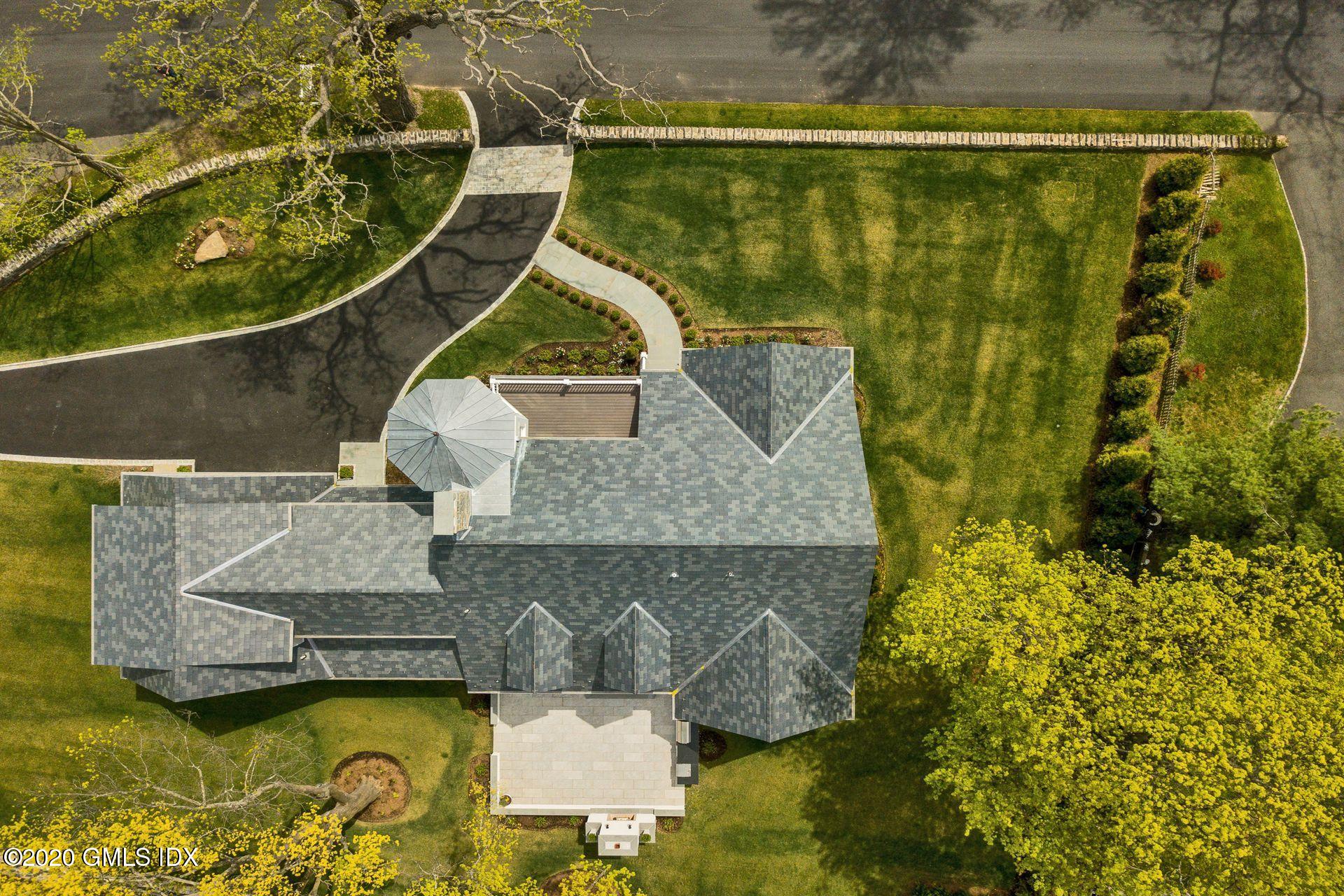 154 Byram Shore Road Greenwich, CT 06830 - Photo 5 of 37 an aerial view of a house with swimming pool