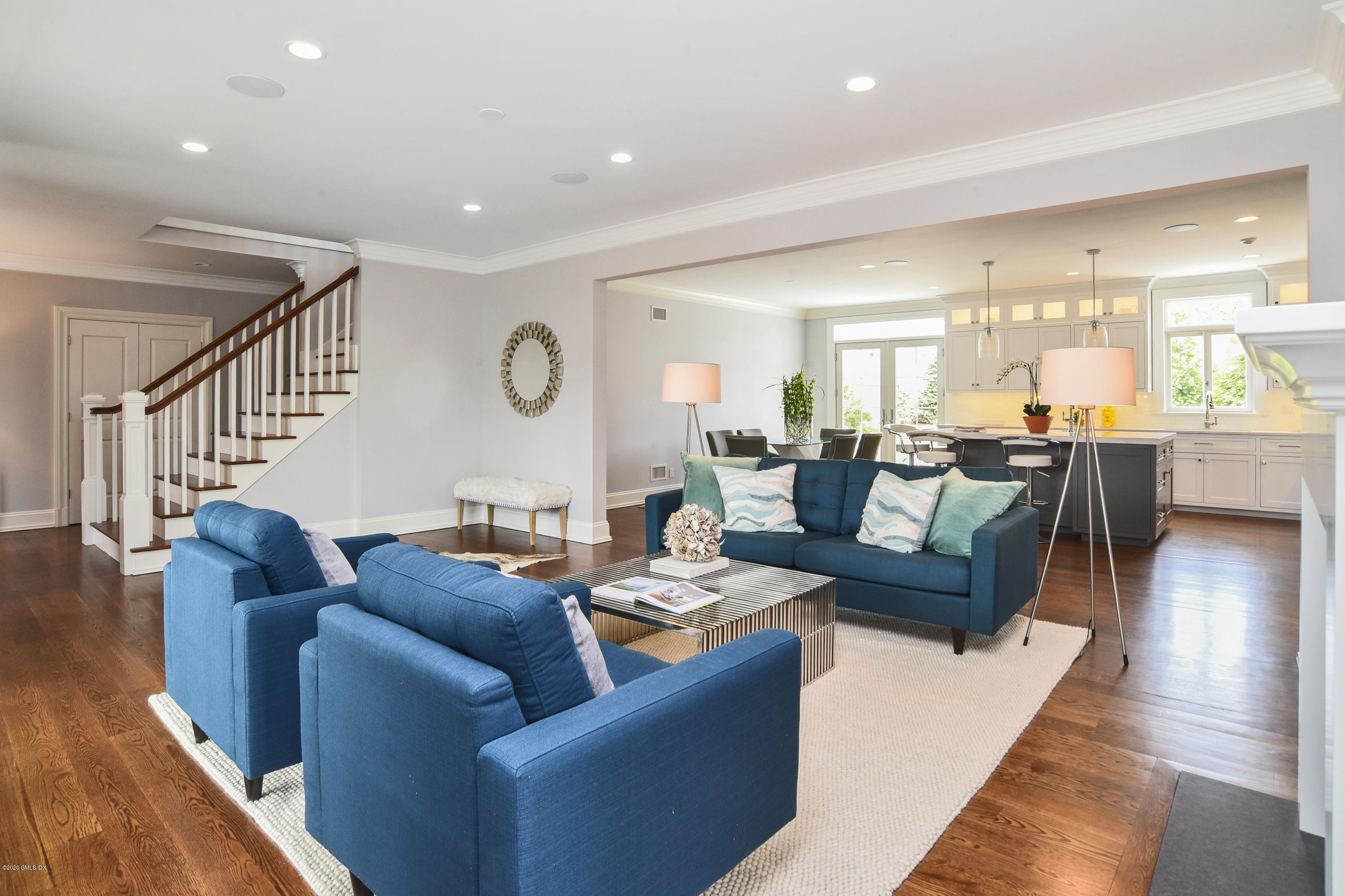 154 Byram Shore Road Greenwich, CT 06830 - Photo 6 of 37 a living room with furniture wooden floor and a large window