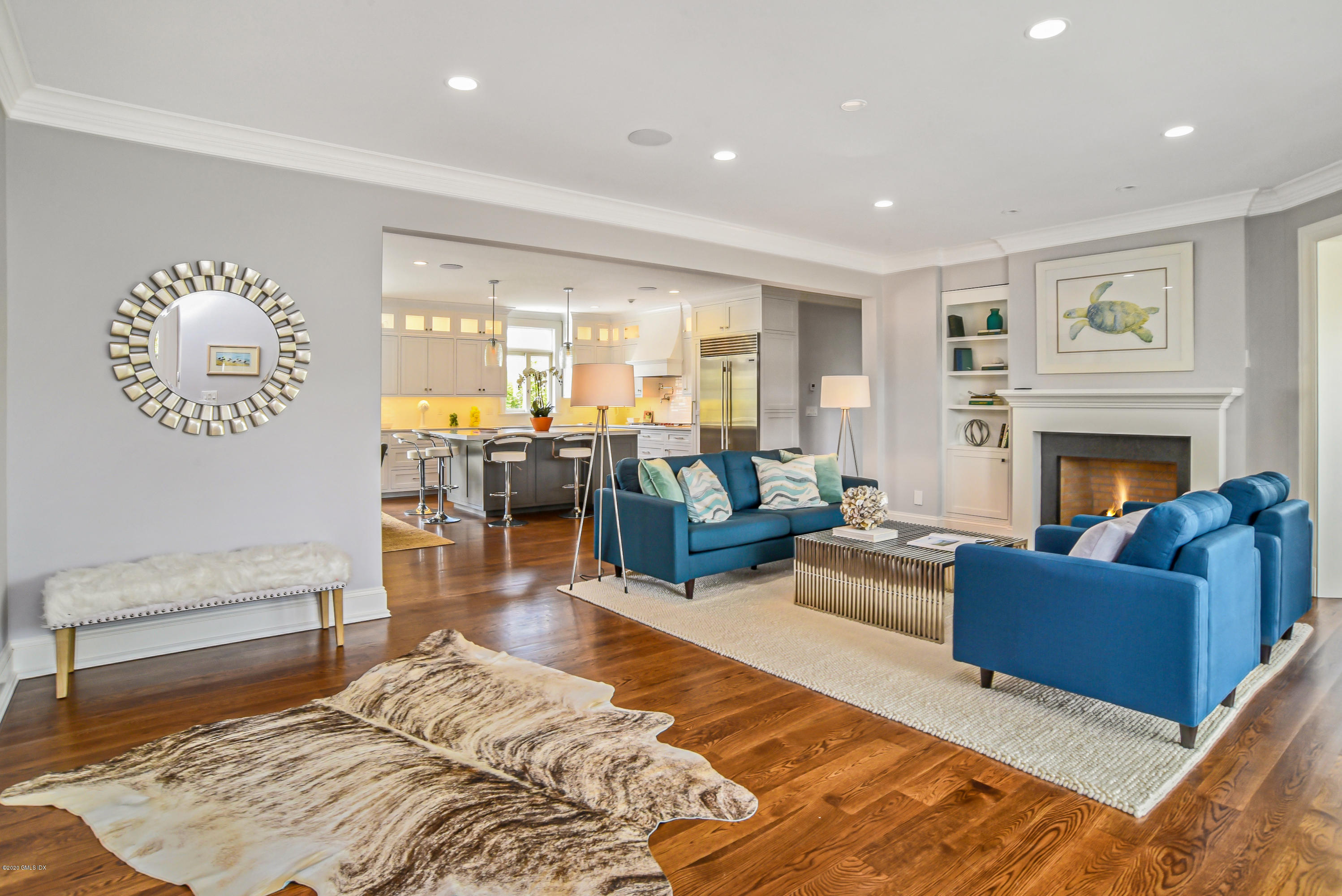 154 Byram Shore Road Greenwich, CT 06830 - Photo 7 of 37 a living room with furniture or couch and a fireplace