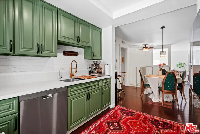 a kitchen with lots of counter top space and appliances