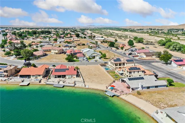 an aerial view of a house with a ocean view