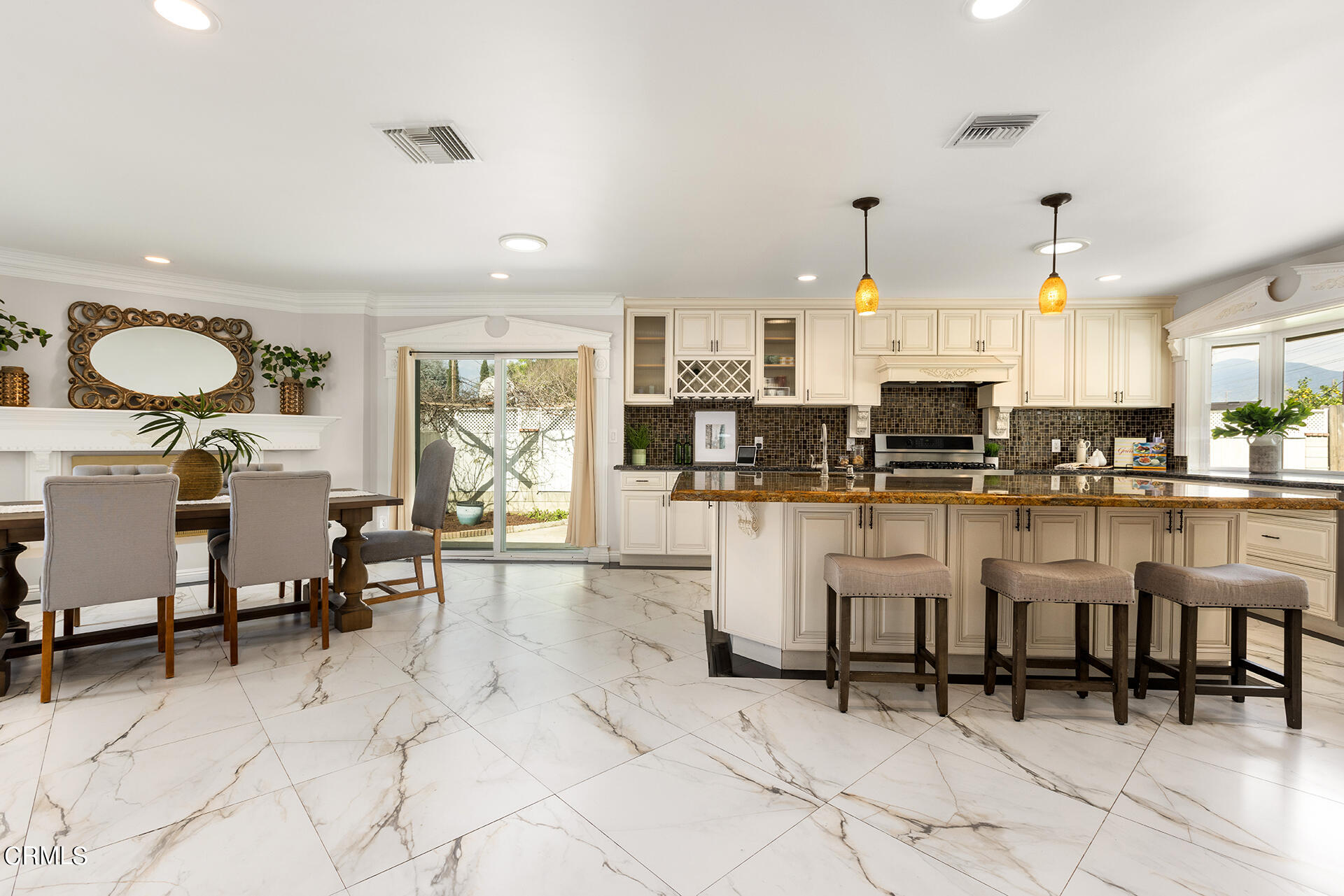 8601 Duarte Road San Gabriel, CA 91775 - Photo 5 of 26 a kitchen with white cabinets and chairs