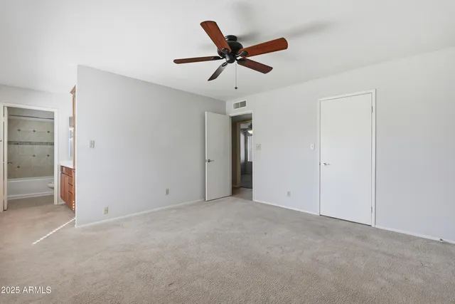 a bathroom with a toilet and a bathtub