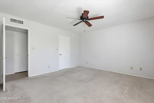 a bathroom with a sink a toilet and vanity