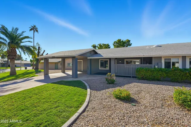 front view of a house with a yard