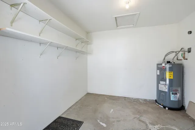 an aerial view of a house with a garden and lake view