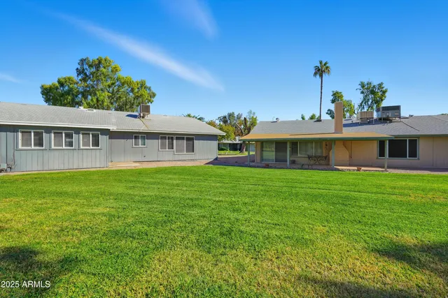 a room with lots of furniture and a wooden floor