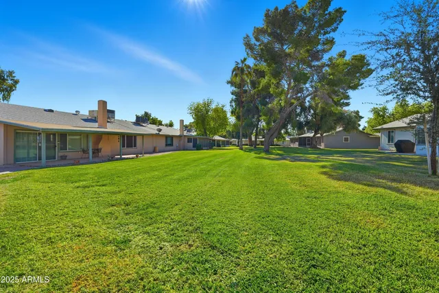 a view of a patio with a table and chairs