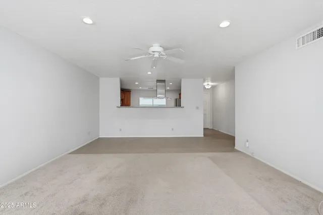 a kitchen with stainless steel appliances granite countertop a sink and a stove top oven