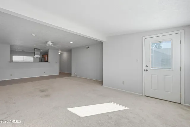 a kitchen with stainless steel appliances granite countertop a stove sink and cabinets