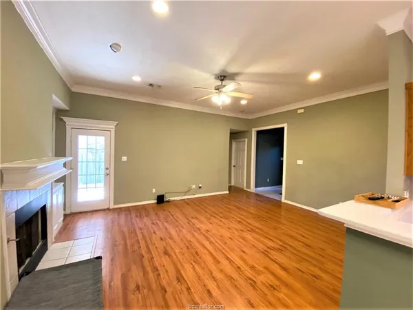 a view of an empty room with a fireplace
