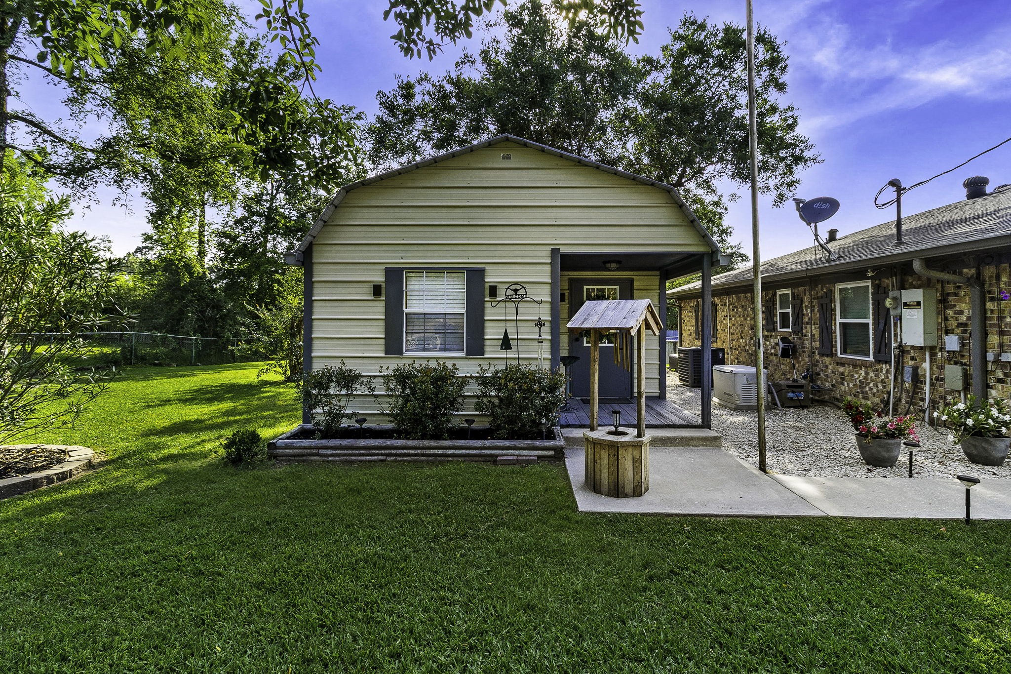 188 Huckleberry Road Onalaska, TX 77360 - Photo 24 of 49 a view of a house with a yard patio and fire pit