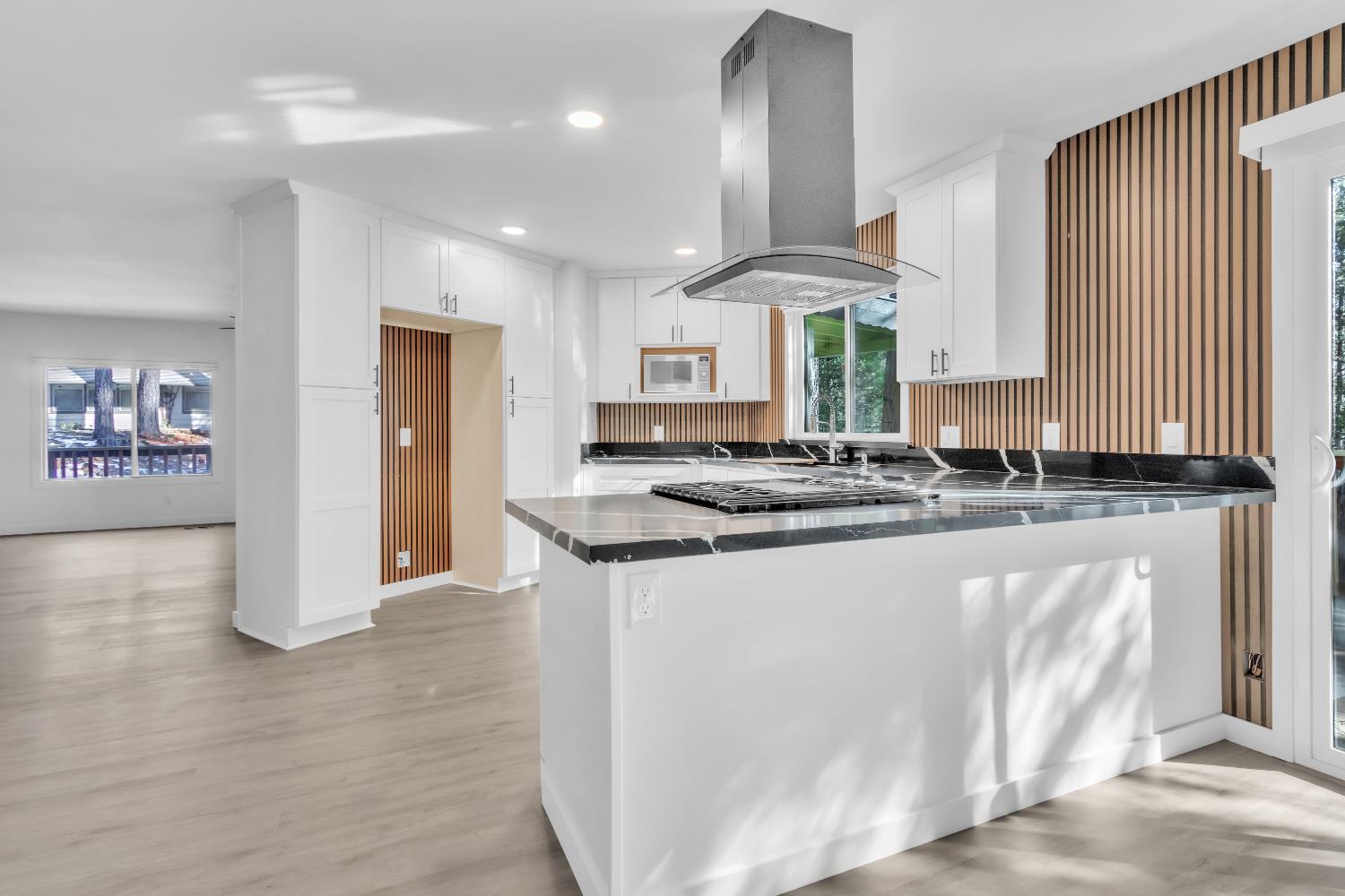 21200 Todd Valley Road, Unit 13 Foresthill, CA 95631 - Photo 1 of 1 a kitchen with stainless steel appliances granite countertop a stove a sink and a refrigerator