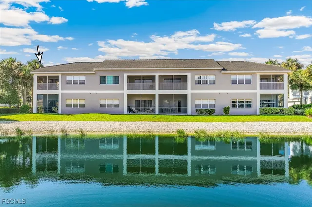 a view of a brick building next to a yard