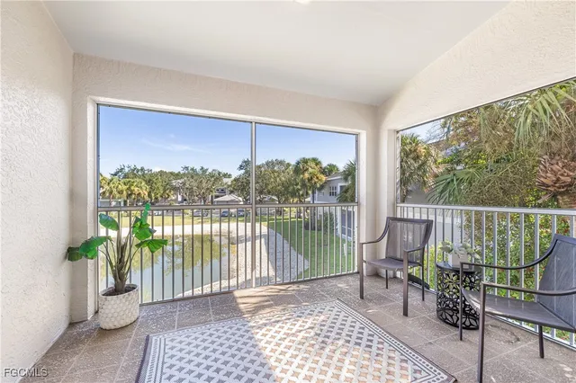 a view of a balcony with chair and the potted plant