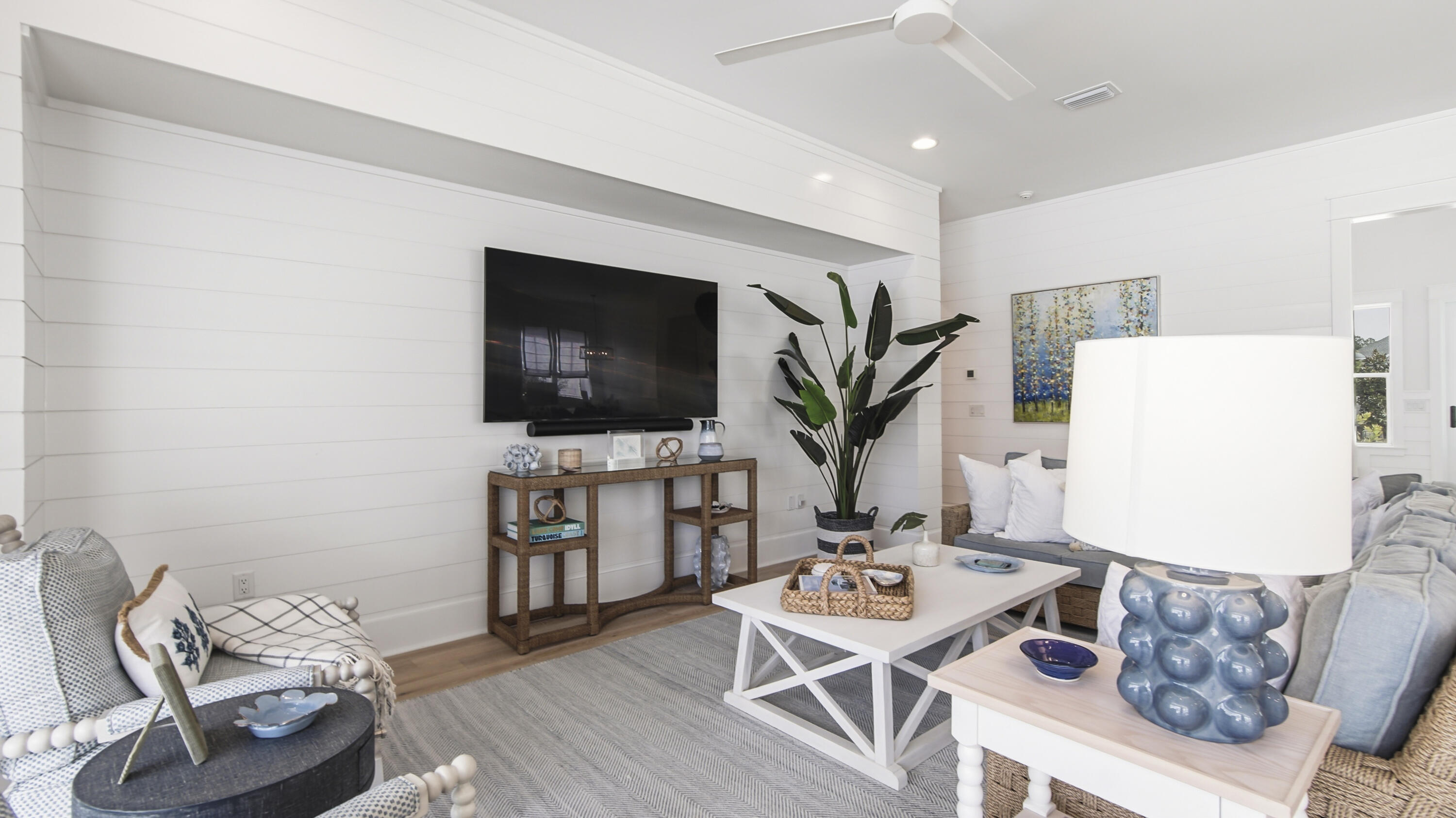 34 Heartwood Street Watersound, FL 32461 - Photo 14 of 42 a living room with furniture and a flat screen tv