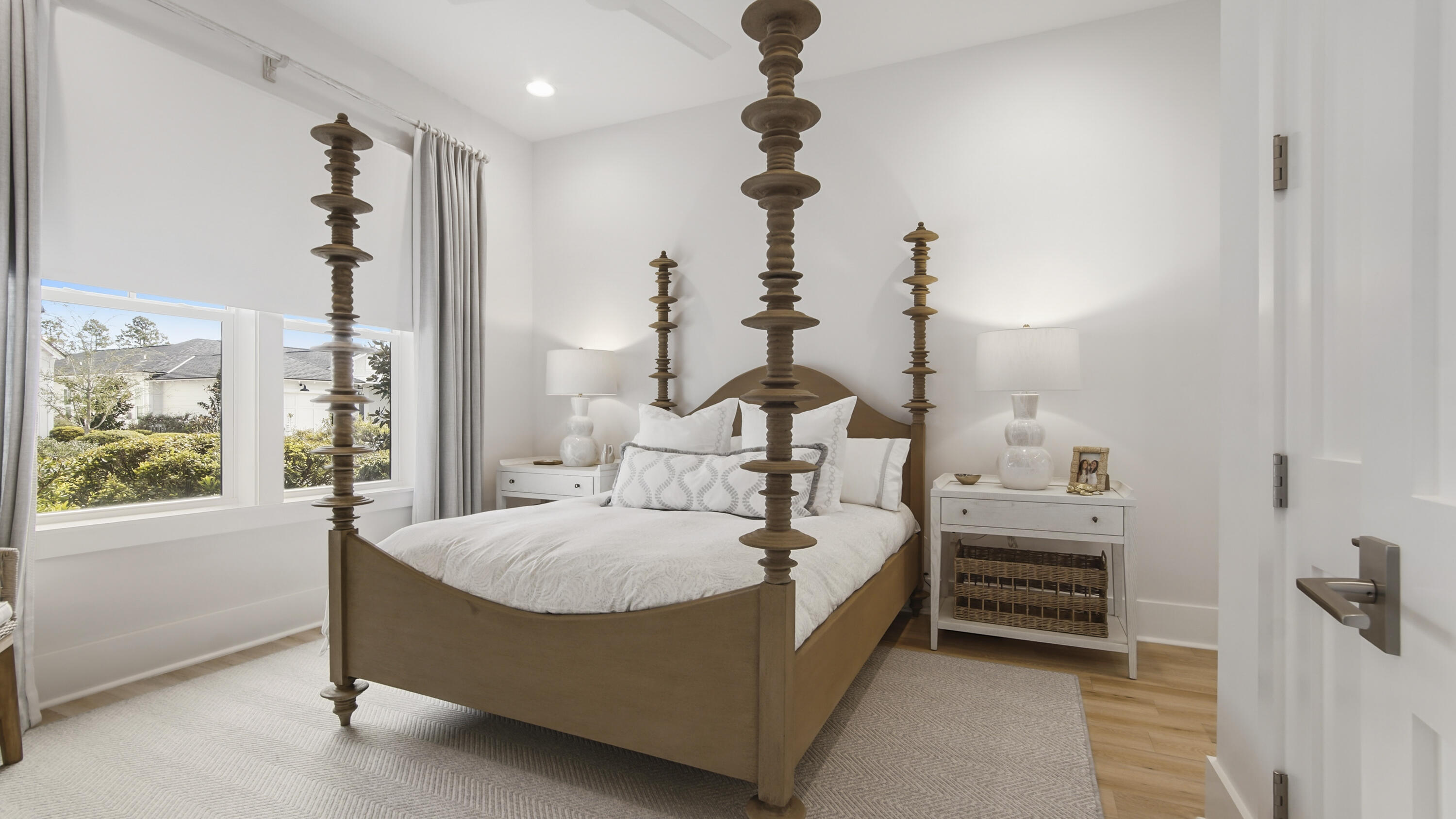 34 Heartwood Street Watersound, FL 32461 - Photo 18 of 42 a bed room with a bed and a chandelier