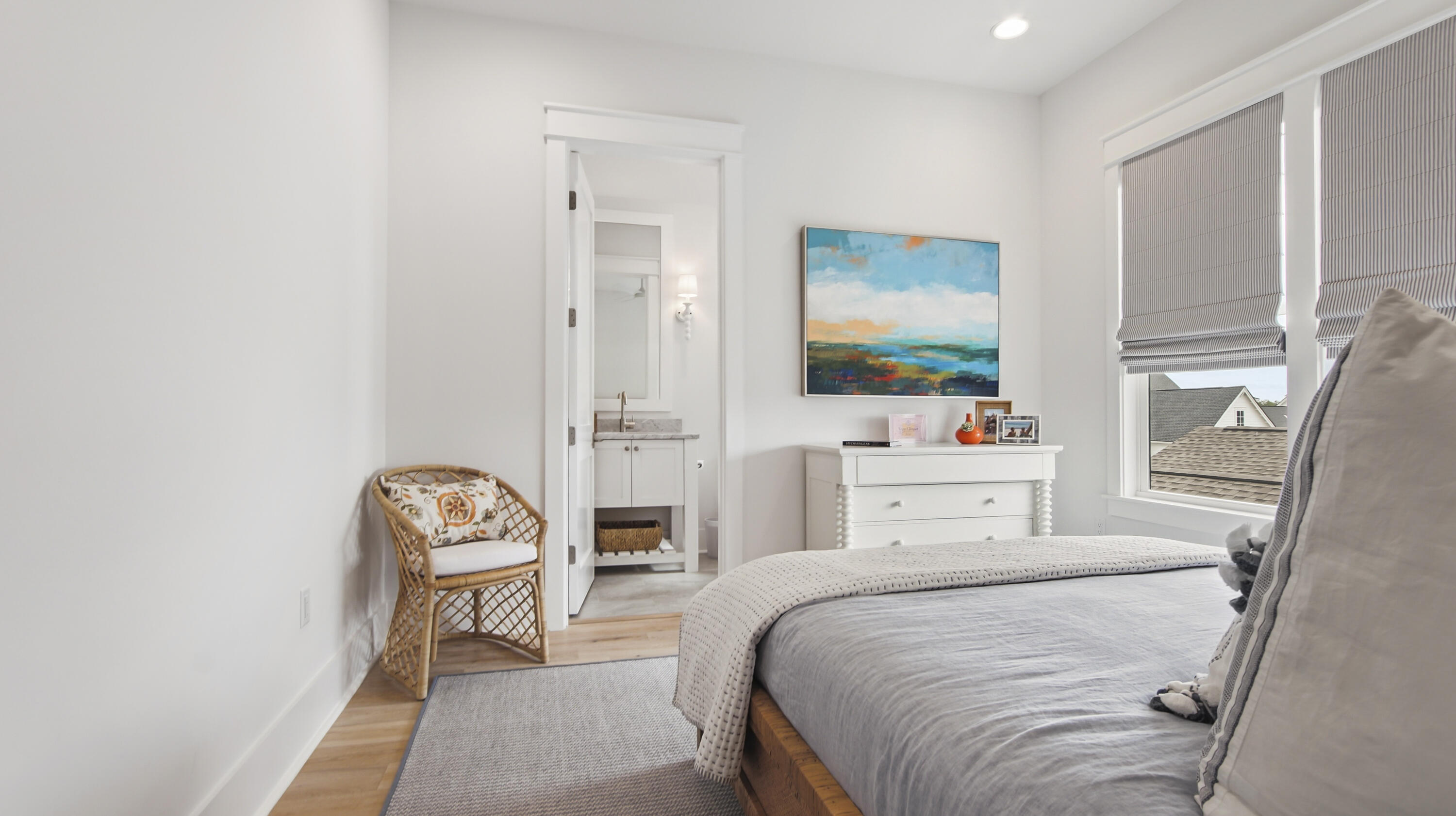 34 Heartwood Street Watersound, FL 32461 - Photo 26 of 42 a bedroom with a bed and a chandelier