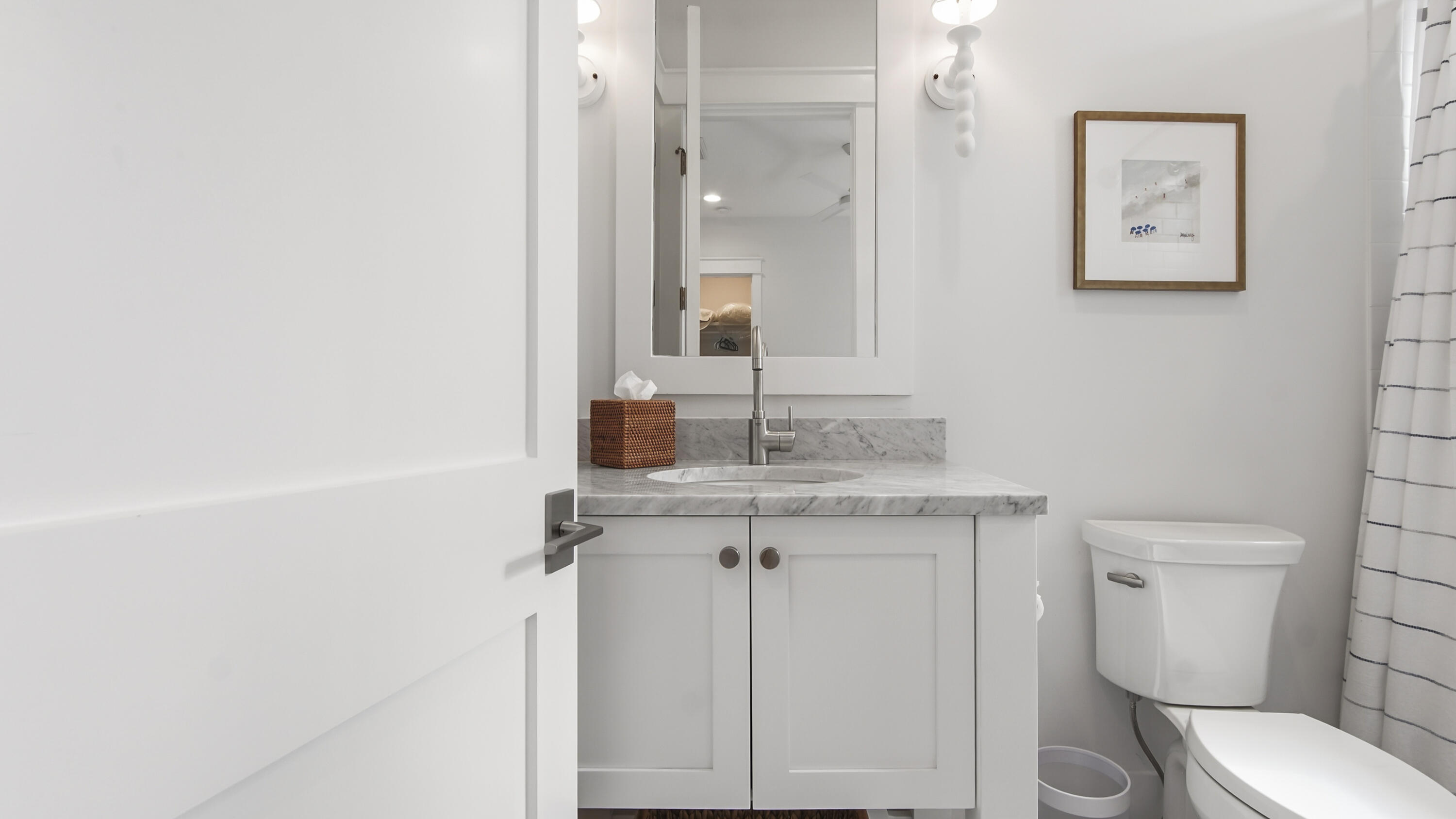 34 Heartwood Street Watersound, FL 32461 - Photo 27 of 42 a bathroom with a granite countertop toilet sink and mirror
