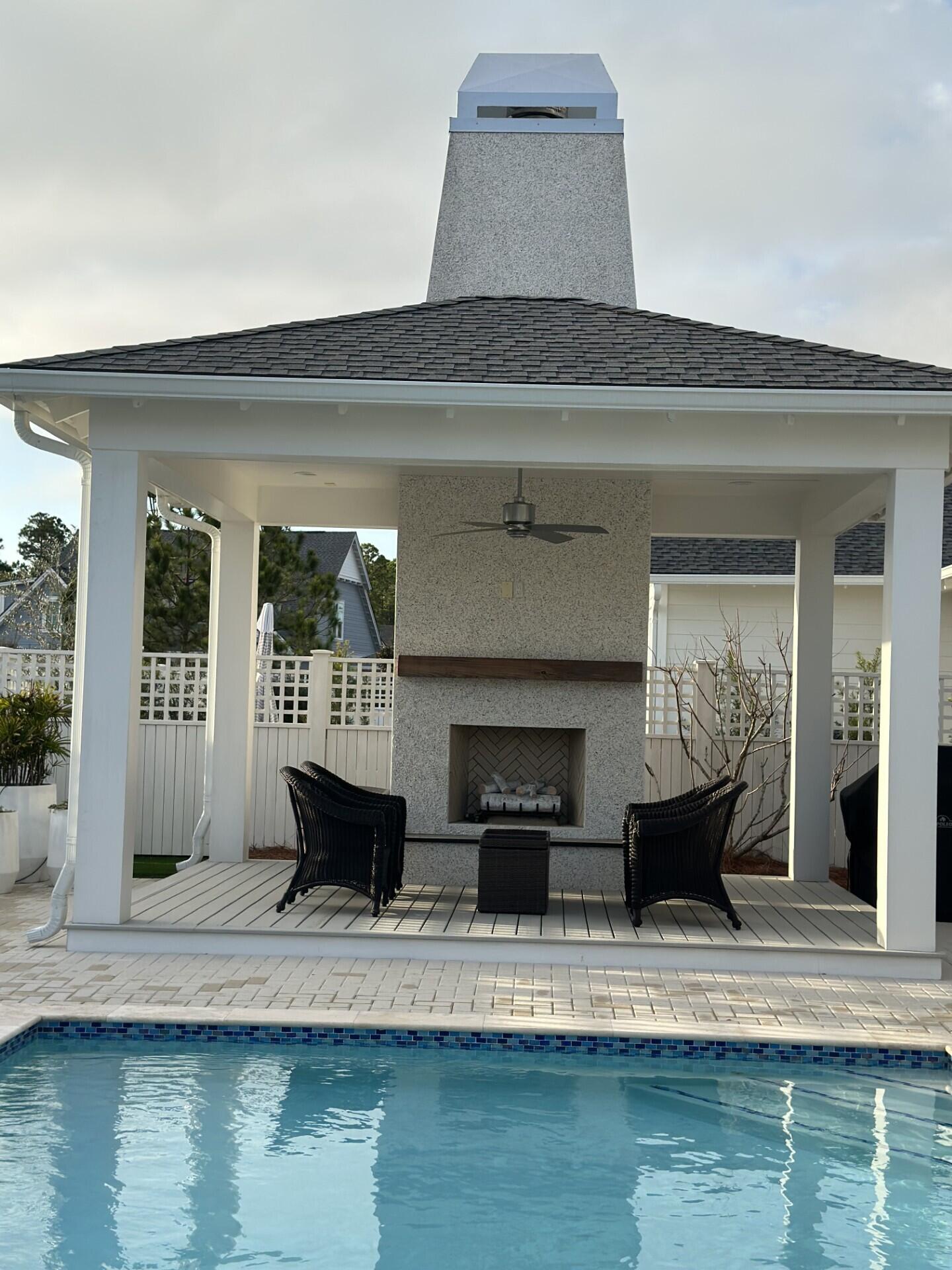 34 Heartwood Street Watersound, FL 32461 - Photo 30 of 42 a living room with a couch and a fireplace