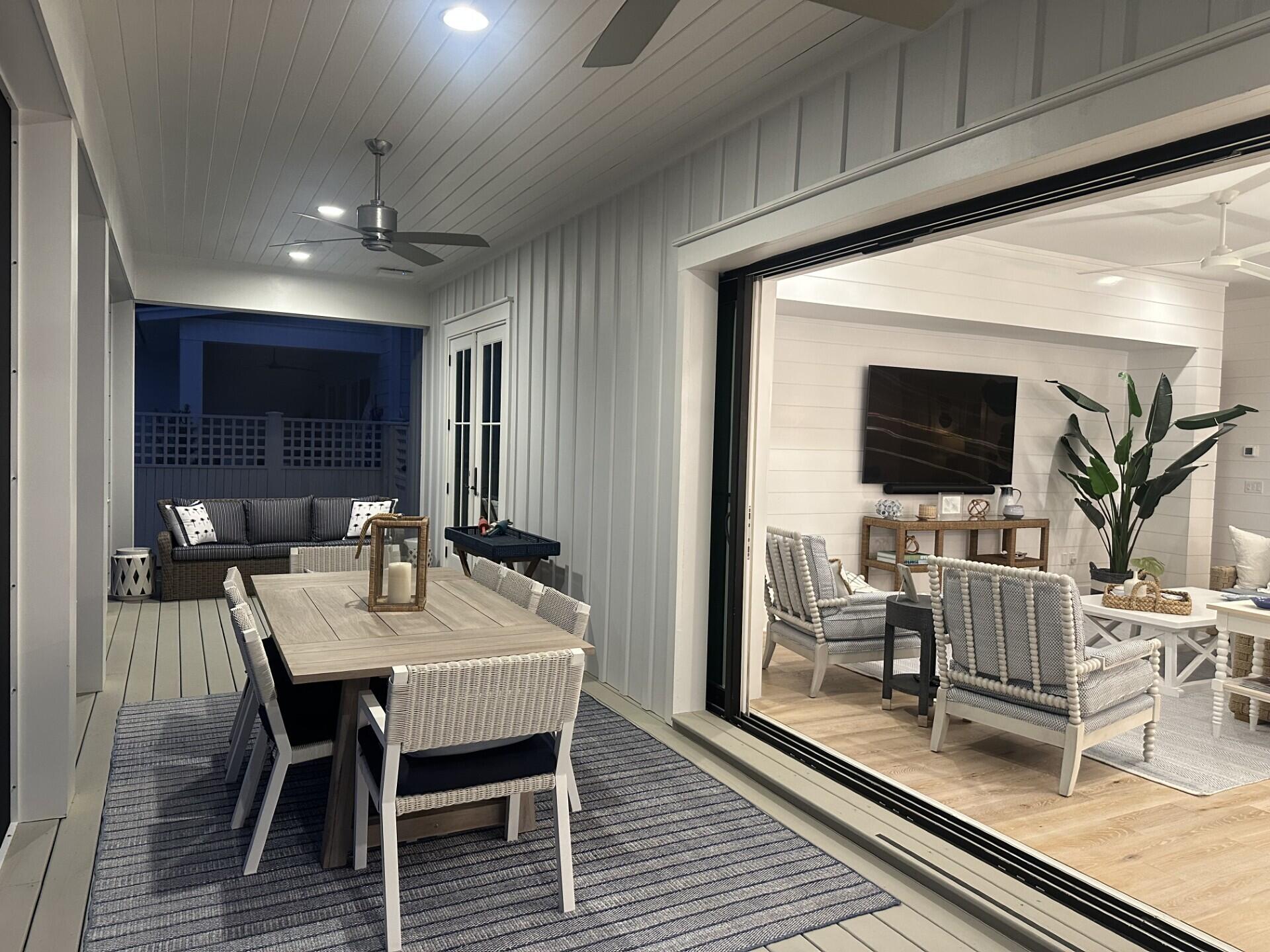 34 Heartwood Street Watersound, FL 32461 - Photo 33 of 42 a view of a dining room with furniture window and wooden floor