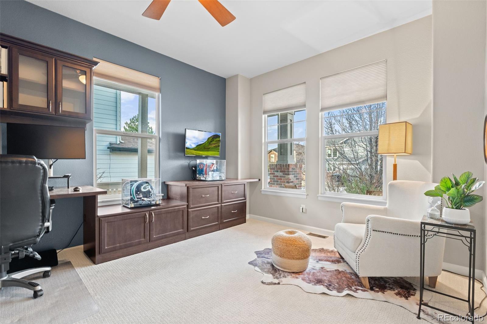 10683 Amesbury Way Highlands Ranch, CO 80126 - Photo 22 of 44 a room with furniture and windows