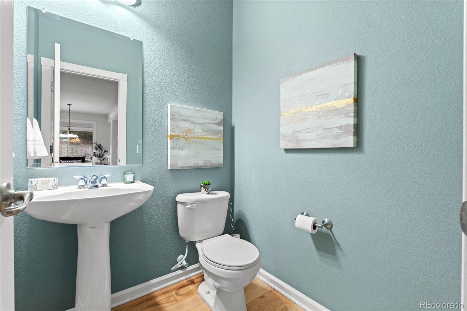 10683 Amesbury Way Highlands Ranch, CO 80126 - Photo 23 of 44 a bathroom with a toilet sink and mirror