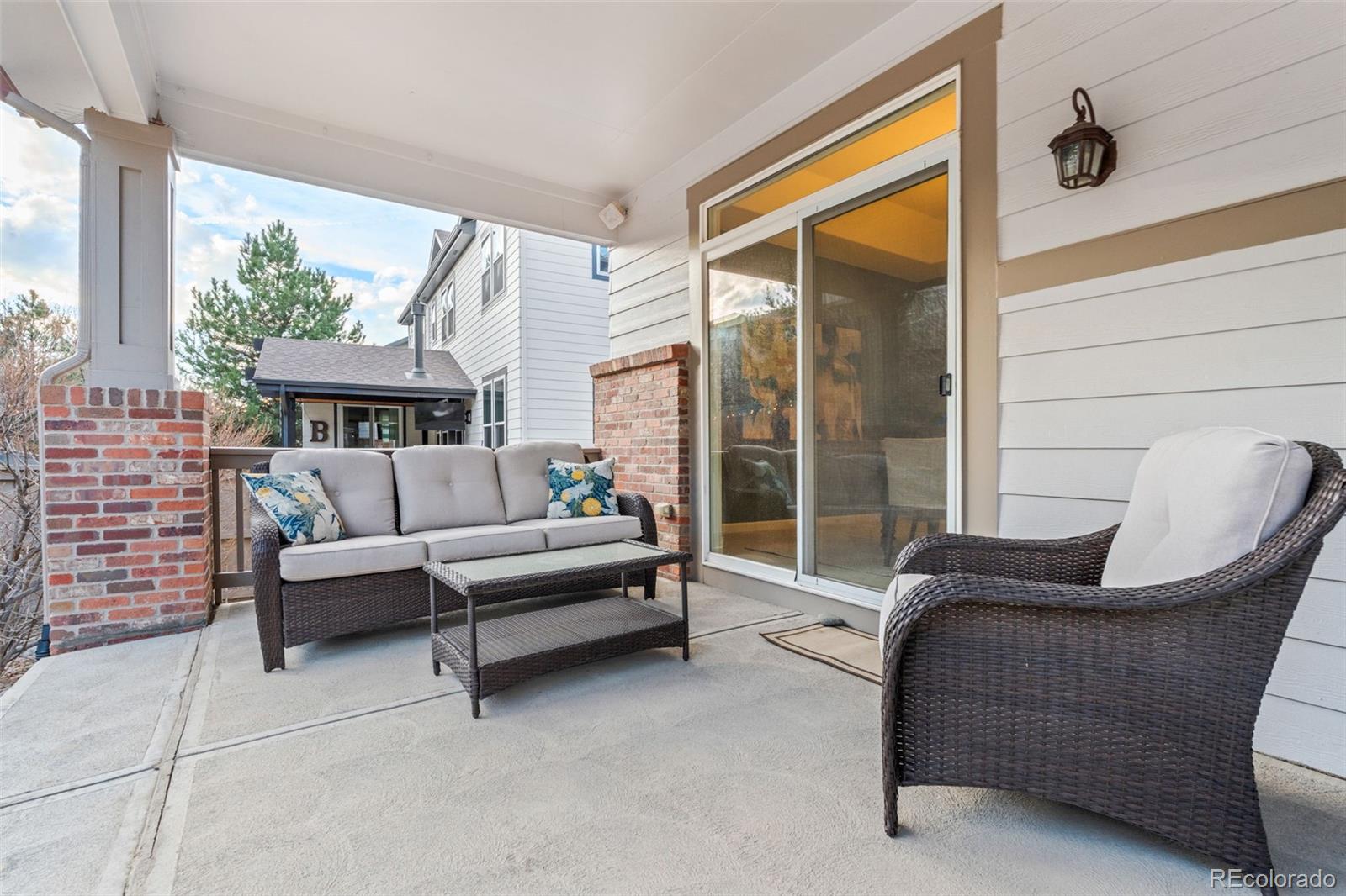 10683 Amesbury Way Highlands Ranch, CO 80126 - Photo 34 of 44 a living room with furniture and a large window