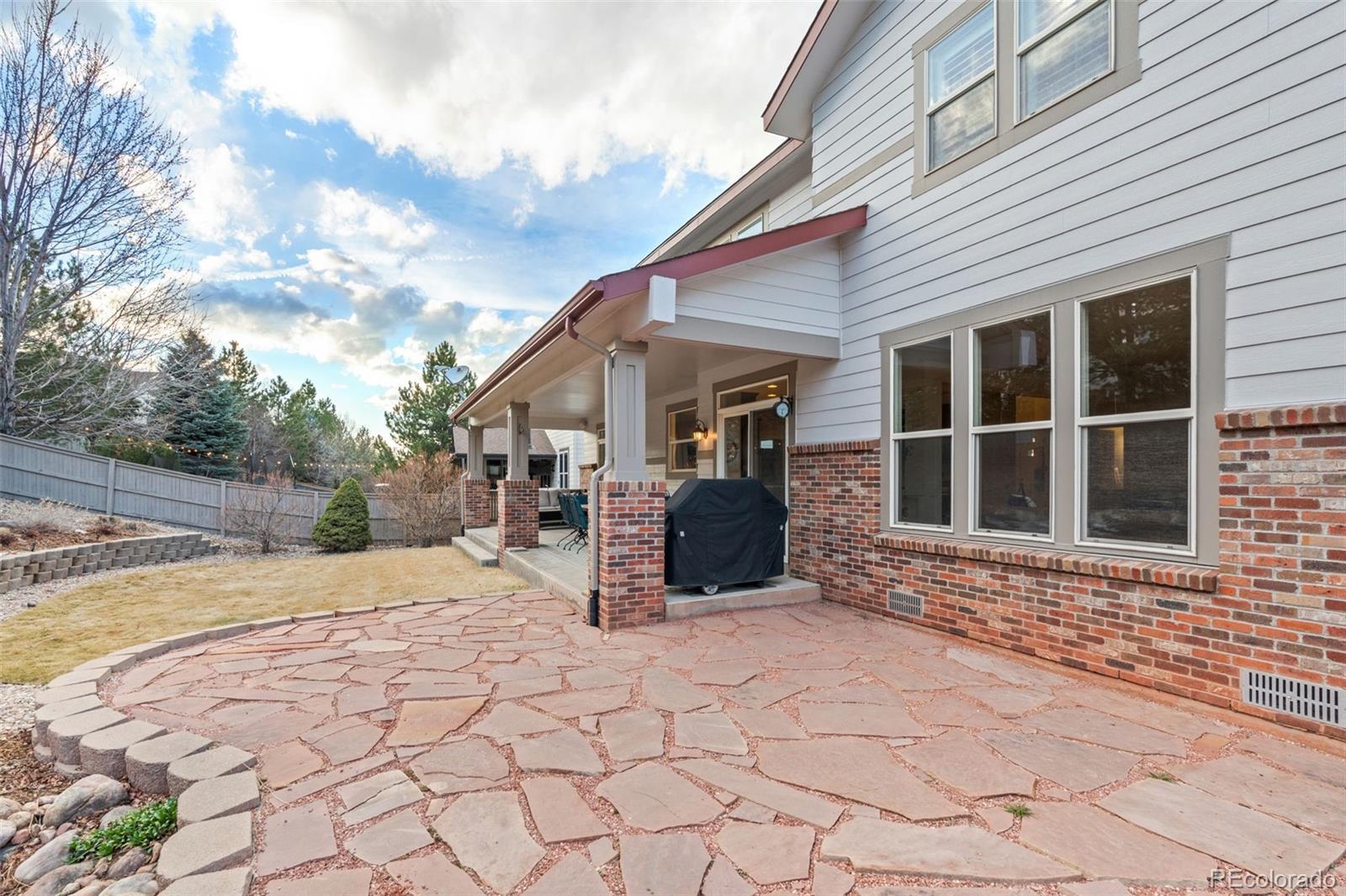 10683 Amesbury Way Highlands Ranch, CO 80126 - Photo 39 of 44 a view of a house with backyard and sitting area