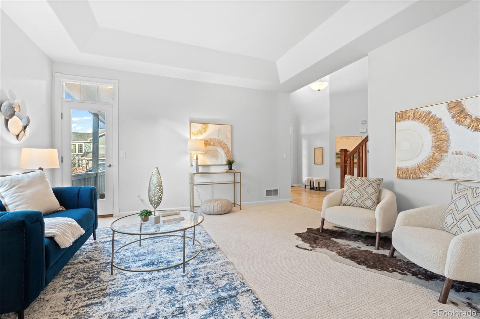 10683 Amesbury Way Highlands Ranch, CO 80126 - Photo 7 of 44 a living room with furniture and a table