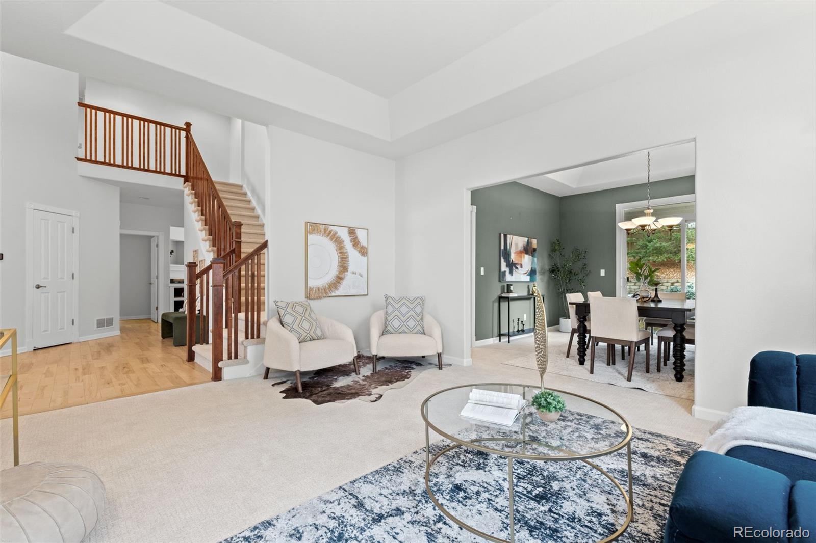 10683 Amesbury Way Highlands Ranch, CO 80126 - Photo 8 of 44 a living room with furniture and a wooden floor
