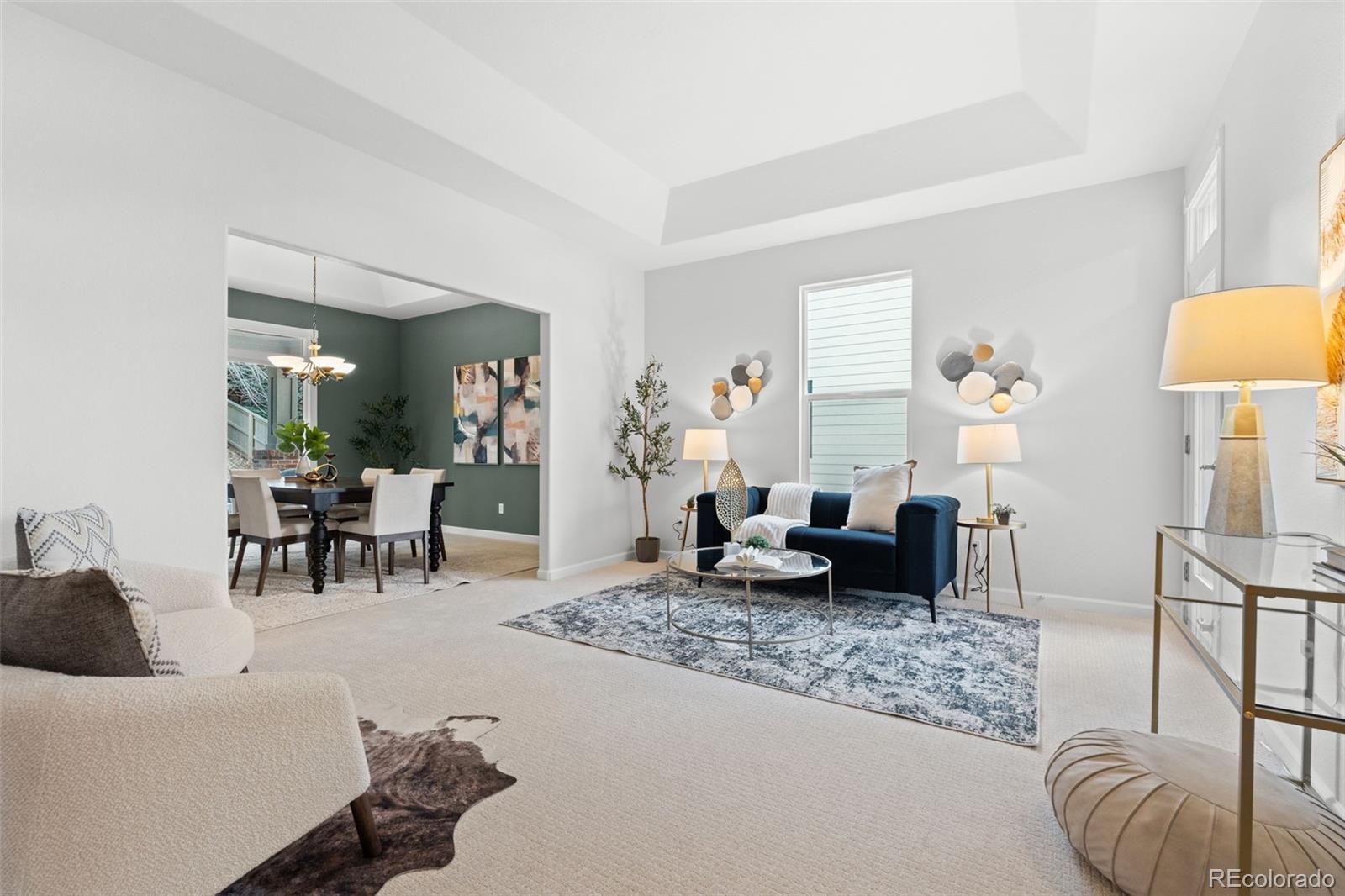 10683 Amesbury Way Highlands Ranch, CO 80126 - Photo 9 of 44 a living room with furniture and wooden floor