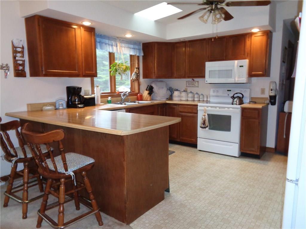 200 Cambridge Road Dexter, ME 04930 - Photo 2 of 19 Fully applianced kitchen with bar.