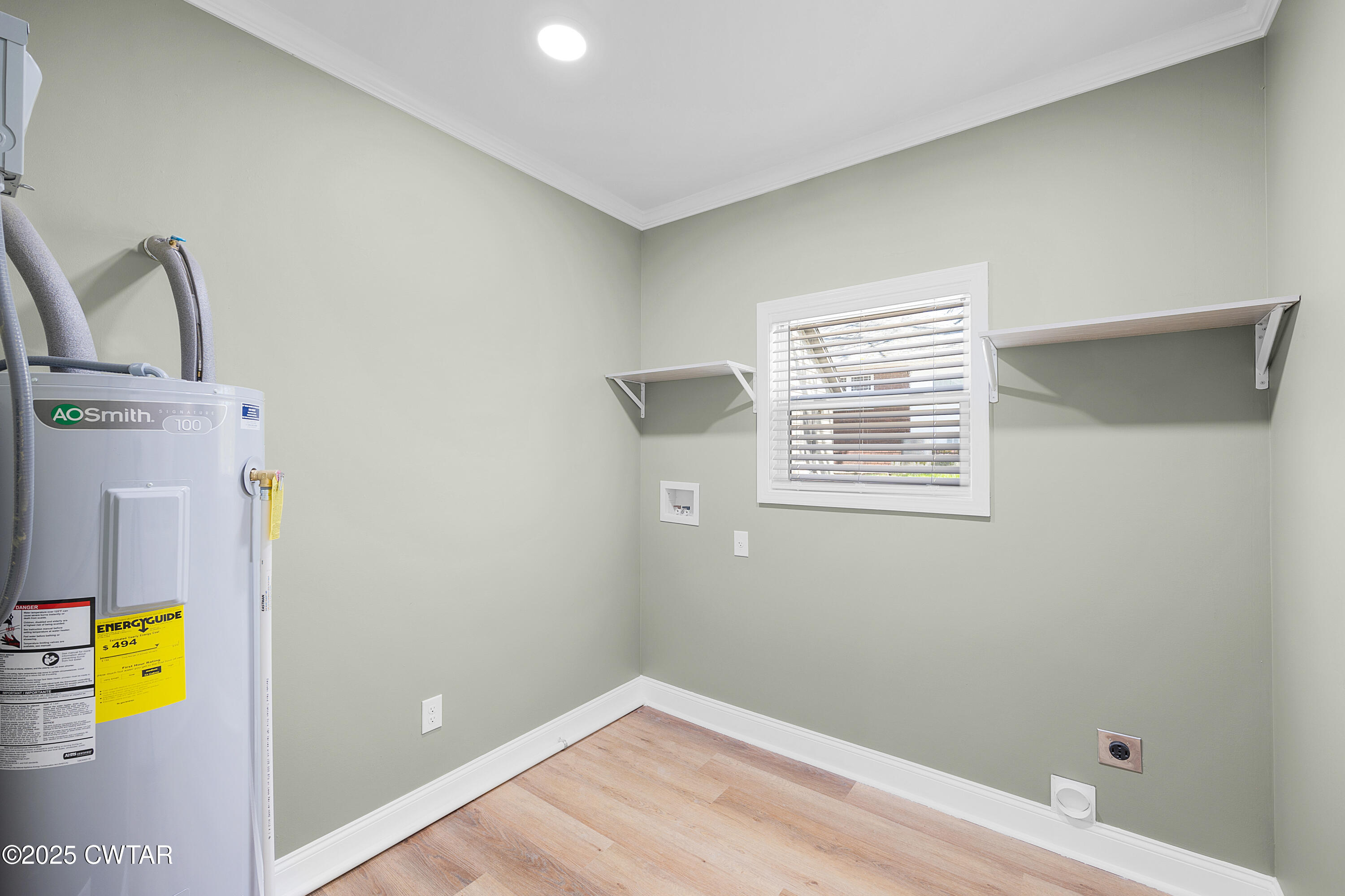 300 West Deaderick Street Jackson, TN 38301 - Photo 4 of 16 a view of storage and utility room with a window