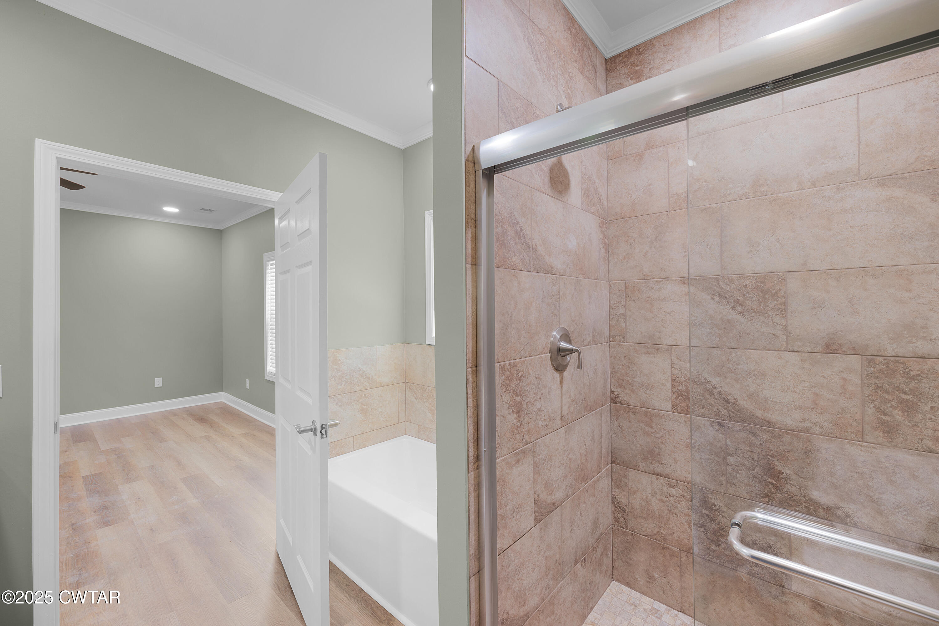 300 West Deaderick Street Jackson, TN 38301 - Photo 7 of 16 a bathroom with a shower and a sink